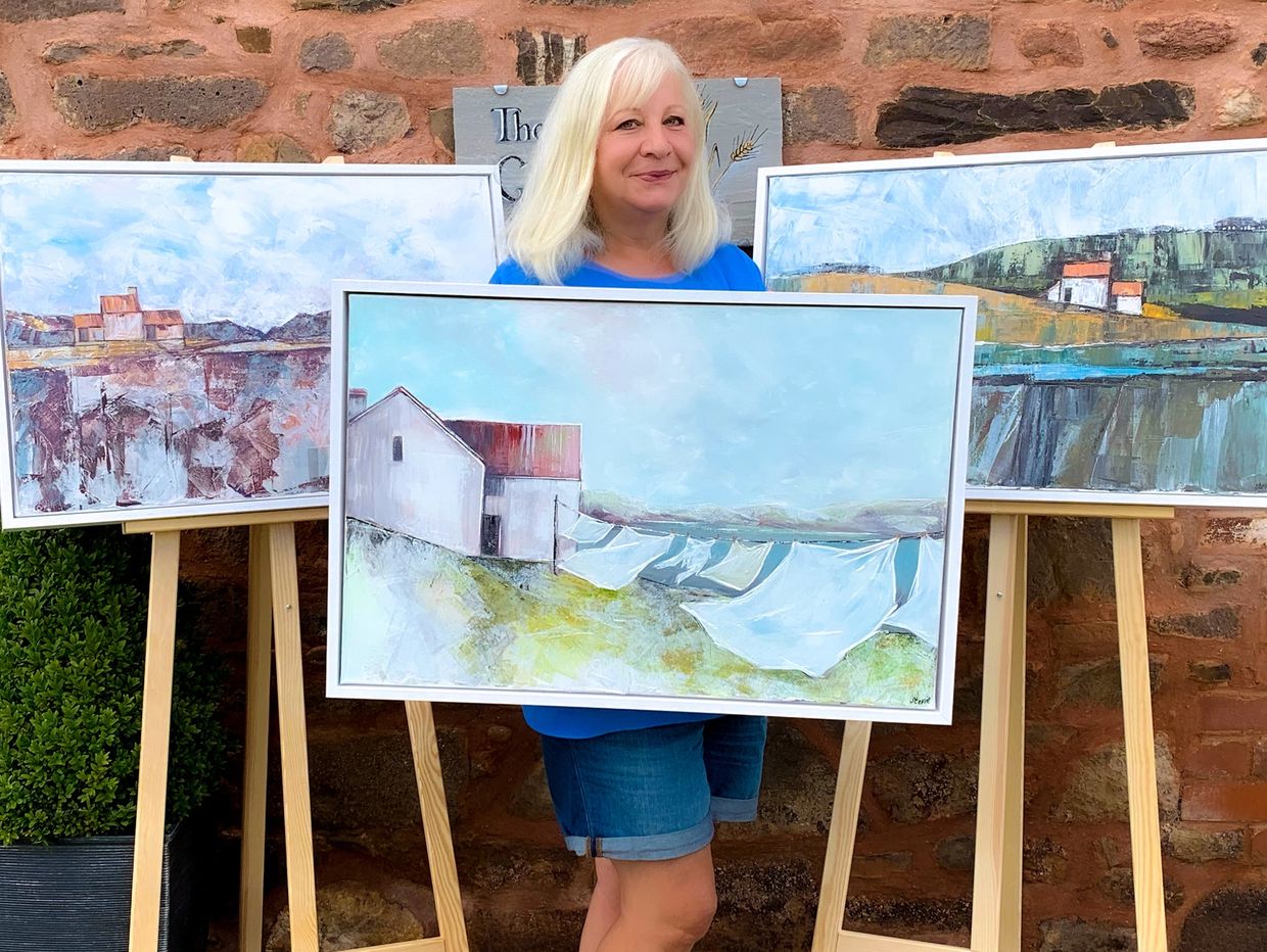 Stevie Wilkinson showing the paintings accepted for the Art Exhibition at The Bath & West 