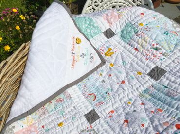 Commissioned, hand quilted baby quilt - pastel colours with woodland animal theme © Sally Quick