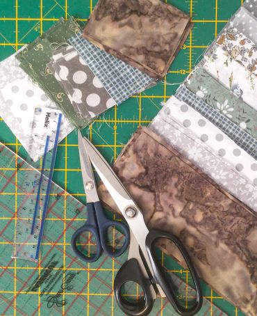 Quilters cutting mat and large rule - cotton fabrics ready to sew © Sally Quick