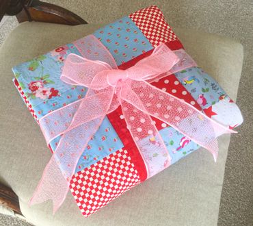 Red and Turquoise Quilt ready for dispatch © Sally Quick