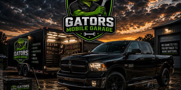 Black truck and trailer of Gators Mobile Garage at sunset with dramatic clouds.