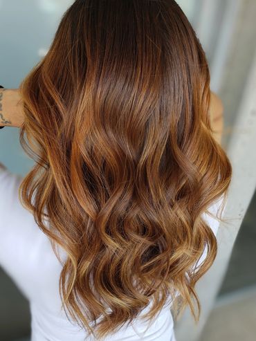 Natural balayage with copper tones hair style