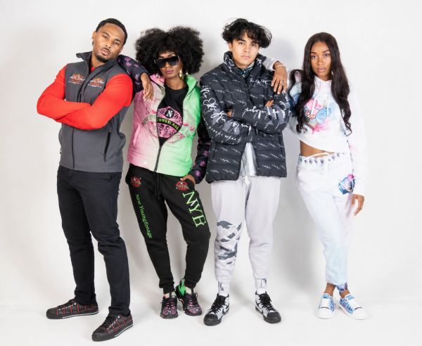 Four diverse models showcasing trendy streetwear with bold colors and graphic designs.