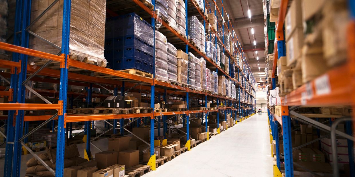 A warehouse demonstrating the organised and efficient logistics of Junior KM.