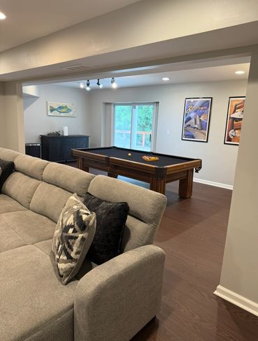 Cozy living area with a pool table and modern decor.