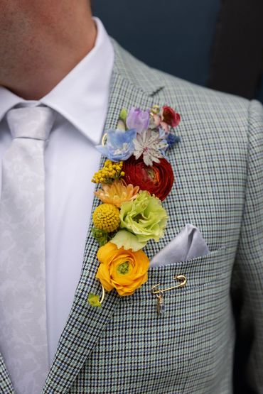Rainbow lapel piece for a two groom Gay Couple at The Fig House, a Los Angeles Wedding Venue.