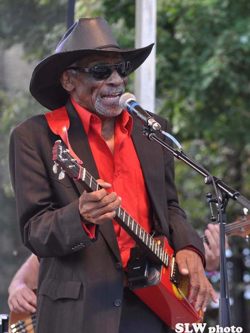 Mac Arnold in cowboy hat and red shirt