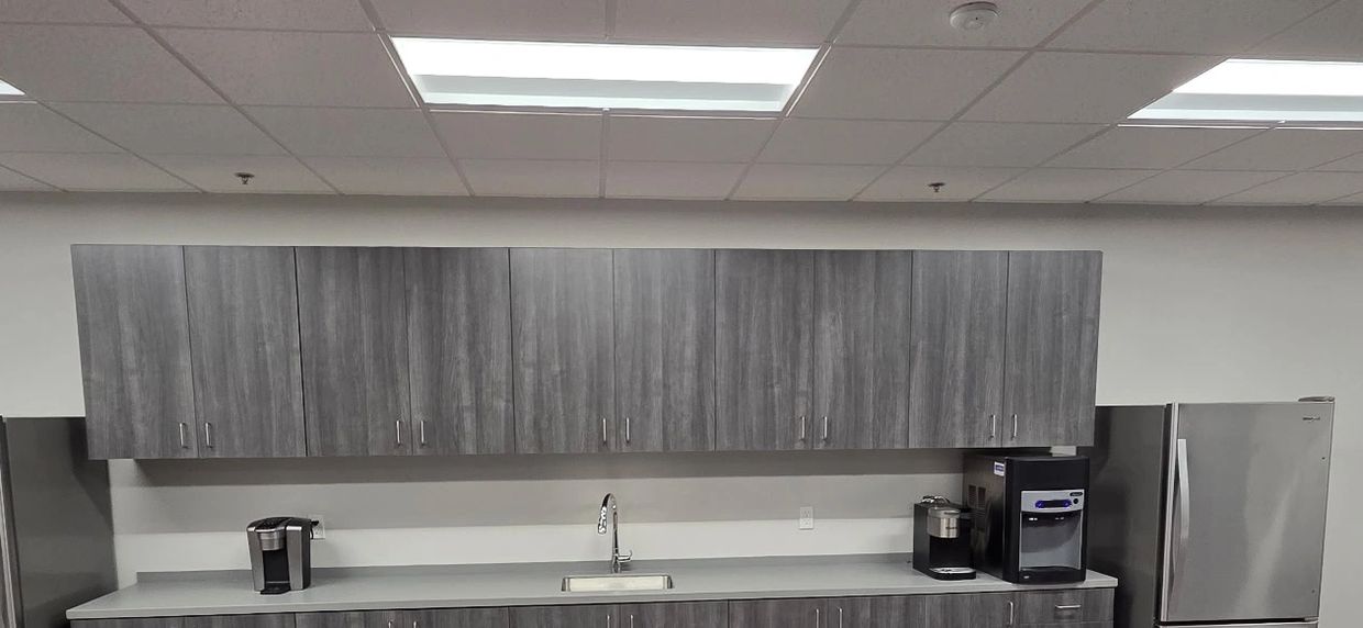 Custom laminate office cabinets creating a modern and organized environment.