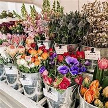 Elegant home décor flower arrangement with roses and lilies.