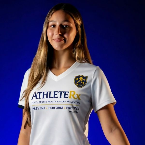 Young woman in AthleteRx sports jersey posing against blue background.