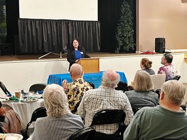 Paula Collins at podium