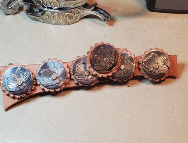Custom silver flower conchos