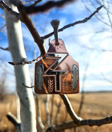 Custom copper cattle tag pendant with silver overlay