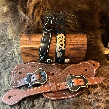 Custom tooled spur straps with custom buckles & matching spurs