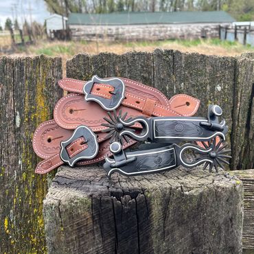 Custom tooled spur straps with custom buckles & matching spurs