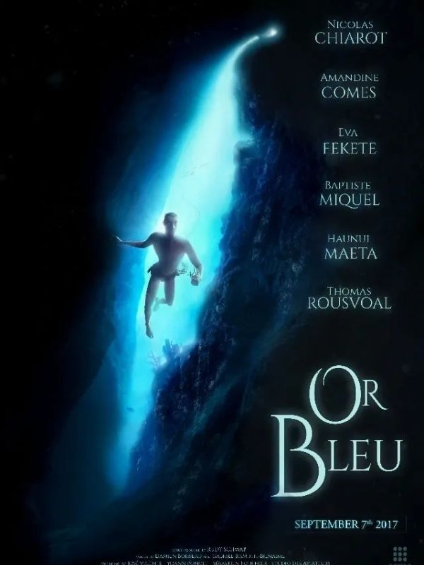 A diver swims upward in a blue underwater cave, titled 'Or Bleu'.