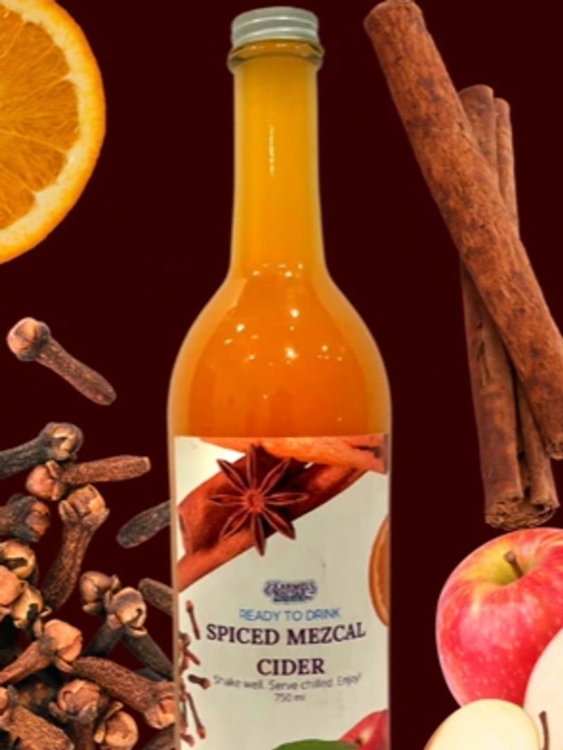 A smoky, sophisticated combination of mezcal, apple cider and lime, spiced to perfection. Serve chil
