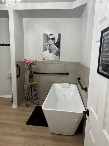 Modern bathroom with a freestanding bathtub and stylish décor.