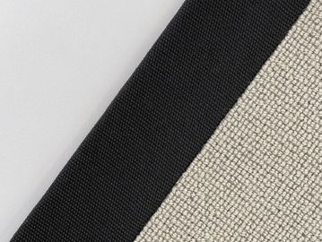Close-up of black and beige woven fabric edges.