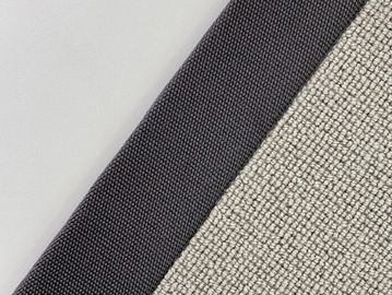 Close-up of two different textured fabric materials, one dark and one light.