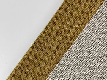 Close-up of two textured fabric pieces, one mustard yellow and one gray.