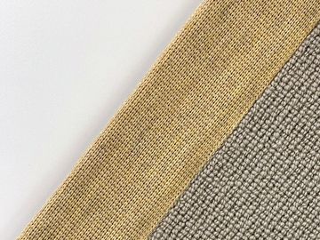 Close-up of fabric with beige and gray woven textures.