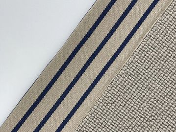 Close-up of a rug with navy blue stripes and textured fabric.