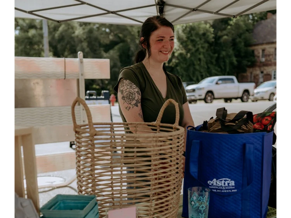A volunteer at the Twin CIty Farmers Market in Dennison, Ohio