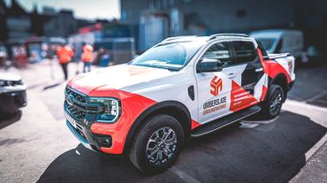 A white and red pickup truck branded with Umberslade Groundworks logo.