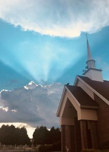 Church with cemetery and sunlight