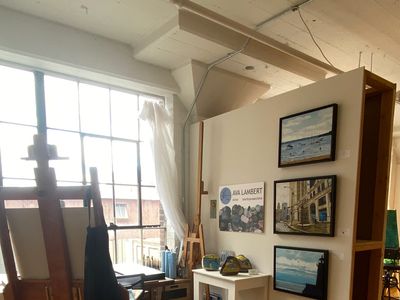 Artist's Studio with easels, paintings