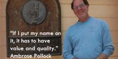 Man standing next to a plaque with an Ambrose Pollock quote about quality and value.
