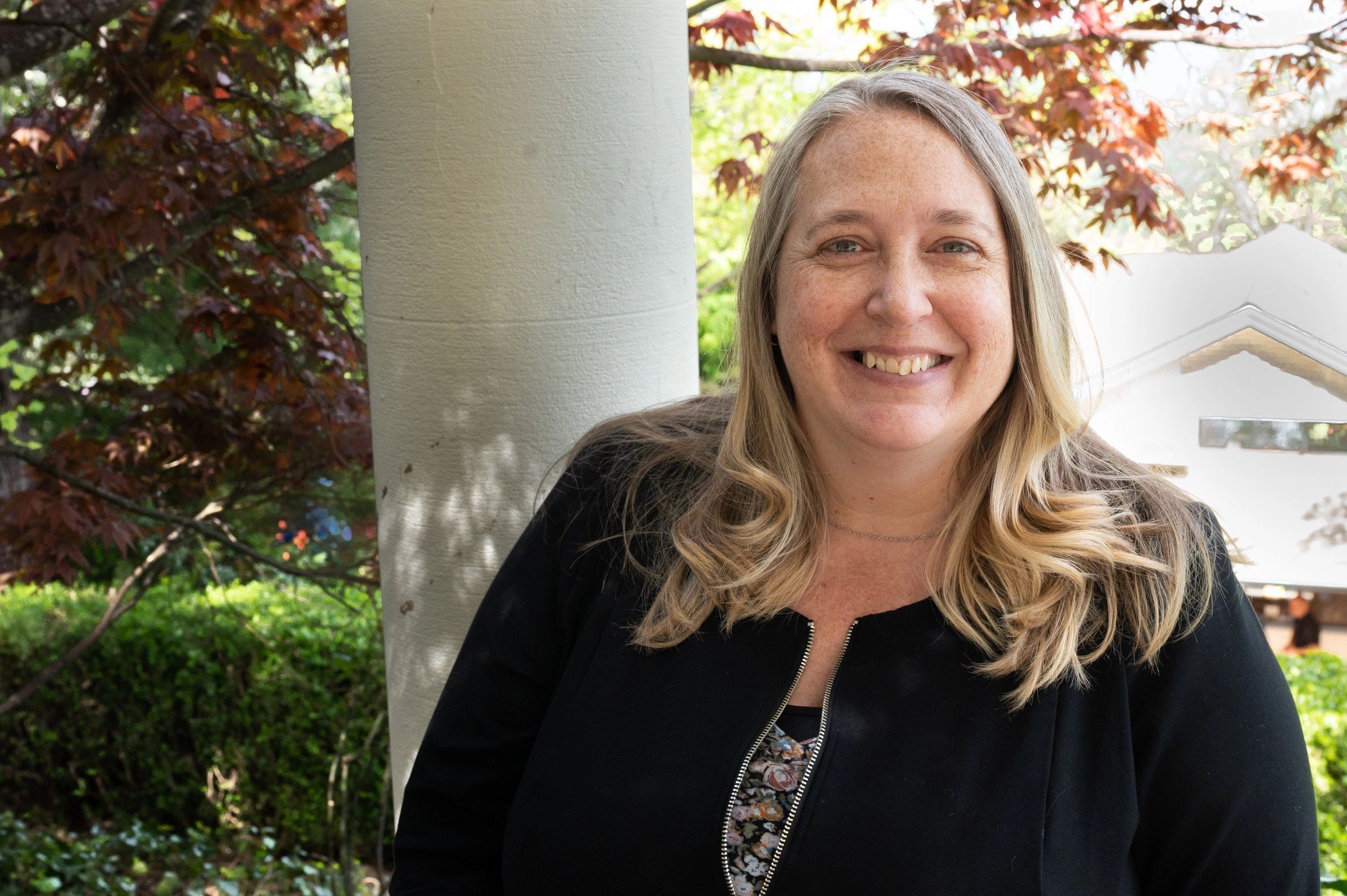 Smiling woman in a garden