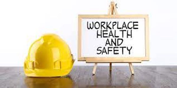 Yellow safety helmet with a sign stating workplace health and safety.