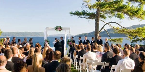 An image of a wedding on Orcas Island in front of the Outlook Inn in the San Juan Islands.