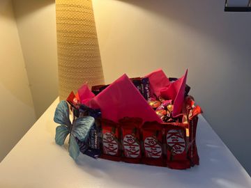 Sweet treat gift box with chocolates and candy.