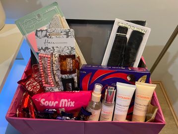 Creative gift hamper with skincare and chocolates.