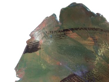 Section of a clay pot with an abstract glazed pattern.