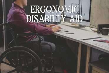 Man in wheelchair working on computer with ergonomic disability aid text overlay.