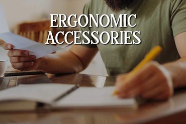 Man working at a desk with ergonomic accessories.
