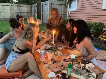 women at the table doing reading