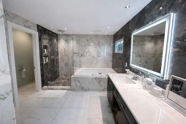 Complete tile installation for bathroom walls, shower, and floor with waterproofing and clean finish