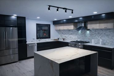 Cabinet installation and geometric tile backsplash upgrade for a clean kitchen look.