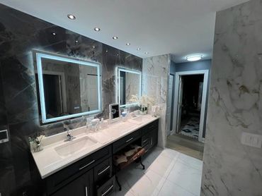 Bathroom remodel with porcelain tile and walk-in shower tile installation. Clean and precise finish.