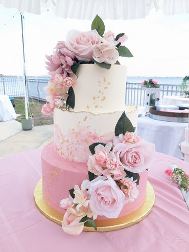 pink buttercream gold flake roses wedding cake