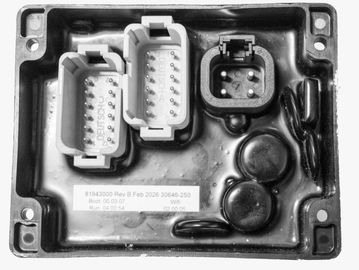 Black automotive control module with connectors.