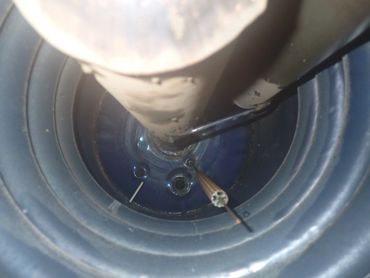 Inside water heater, looking for glass liner degradation.