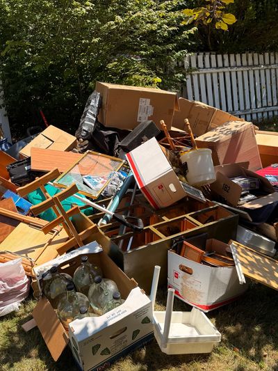 Household junk and unwanted furniture prepared for removal in Southern Maine.