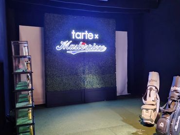10' Tall Boxwood Hedge Rental with Custom Signage for Corporate Activation