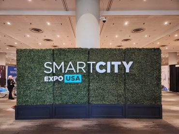8' tall boxwood hedge wall plus custom signage for exhibition at South Street Seaport, NYC.